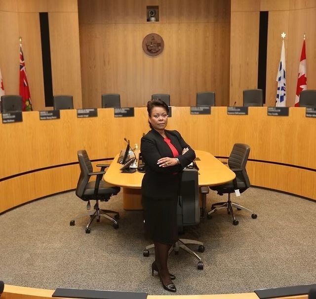 Suzanne Craig in a municipal council chamber